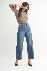 High rise barrel denim jeans in blue with a wide-leg cut and cropped hem for women’s boho chic clothing shop daisy