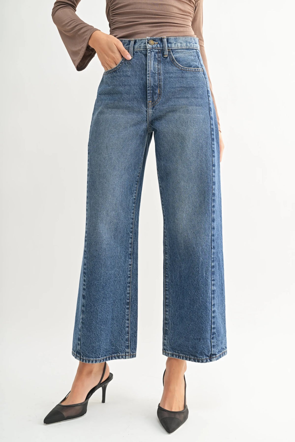 High rise barrel denim jean twist with wide-leg cut and classic stitching in blue denim for women’s boho chic clothing