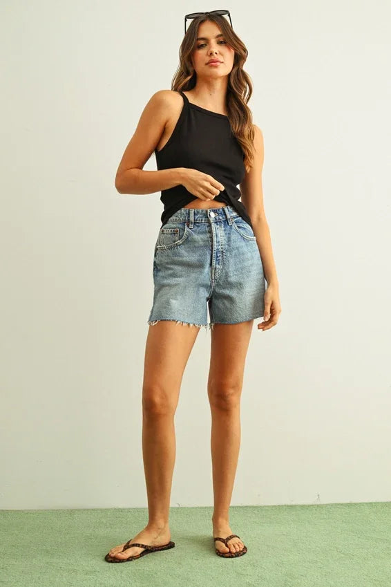 High-waisted faded blue denim shorts with ribbed tank top
