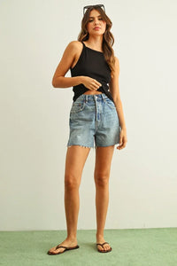 High-waisted faded blue denim shorts with ribbed tank top
