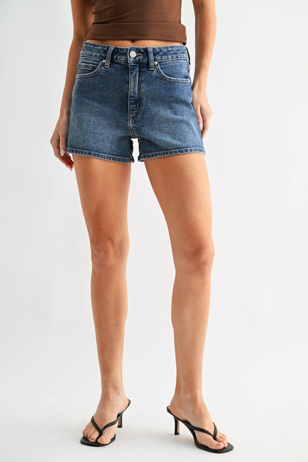 High rise classic hem denim shorts in medium blue wash