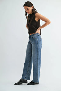 High-waisted medium-blue denim jeans with a straight leg cut in low rise mid wash wide denim style