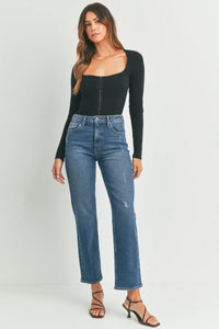 High-waisted full length straight denim jeans in medium blue wash with subtle distressing and classic five-pocket design