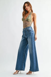 High rise full length loose straight denim jeans in medium blue wash with classic stitching and front pockets