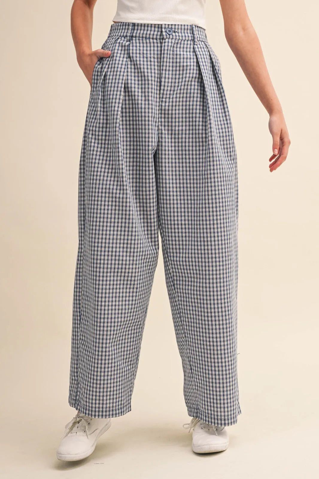 High-waisted wide-leg check pattern pintuck pants in black and white gingham lightweight fabric with pleated front details