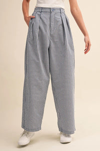 High-waisted wide-leg check pattern pintuck pants in black and white gingham lightweight fabric with pleated front details