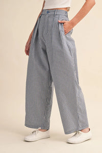 Check pattern pintuck high-waisted wide-leg trousers in navy and white gingham with pleated front pockets and relaxed fit