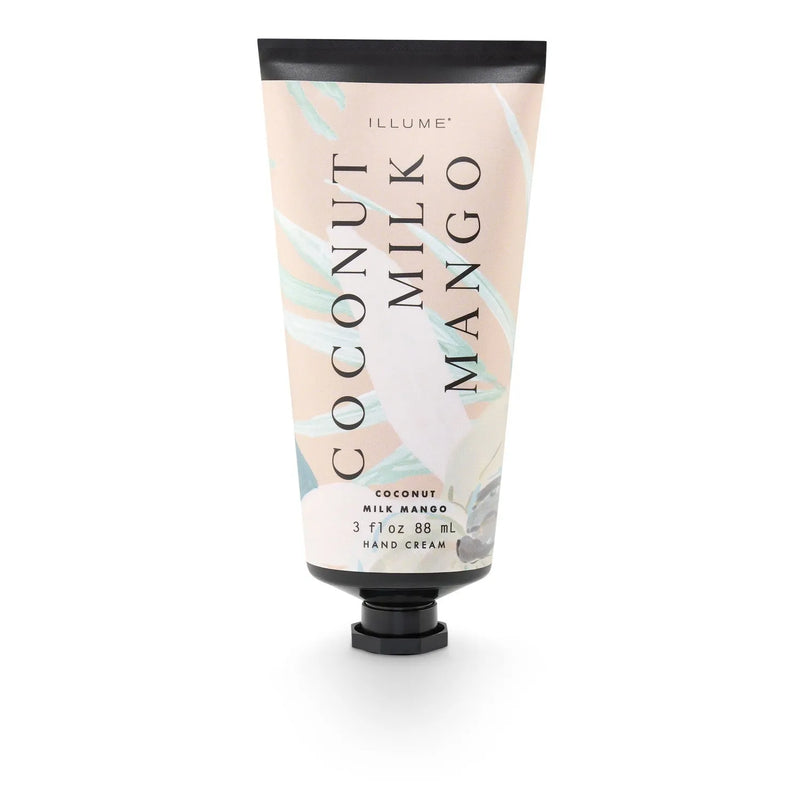Illume coconut milk mango hand cream in a soft pink and white tube with black cap for moisturizing hands