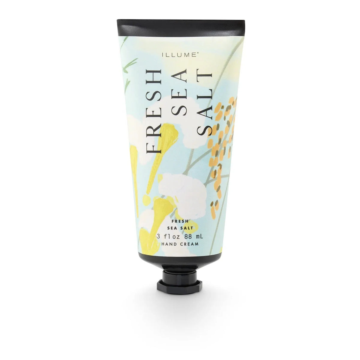 Illume fresh sea salt hand cream in a light blue squeezable tube with yellow floral design for soft skin