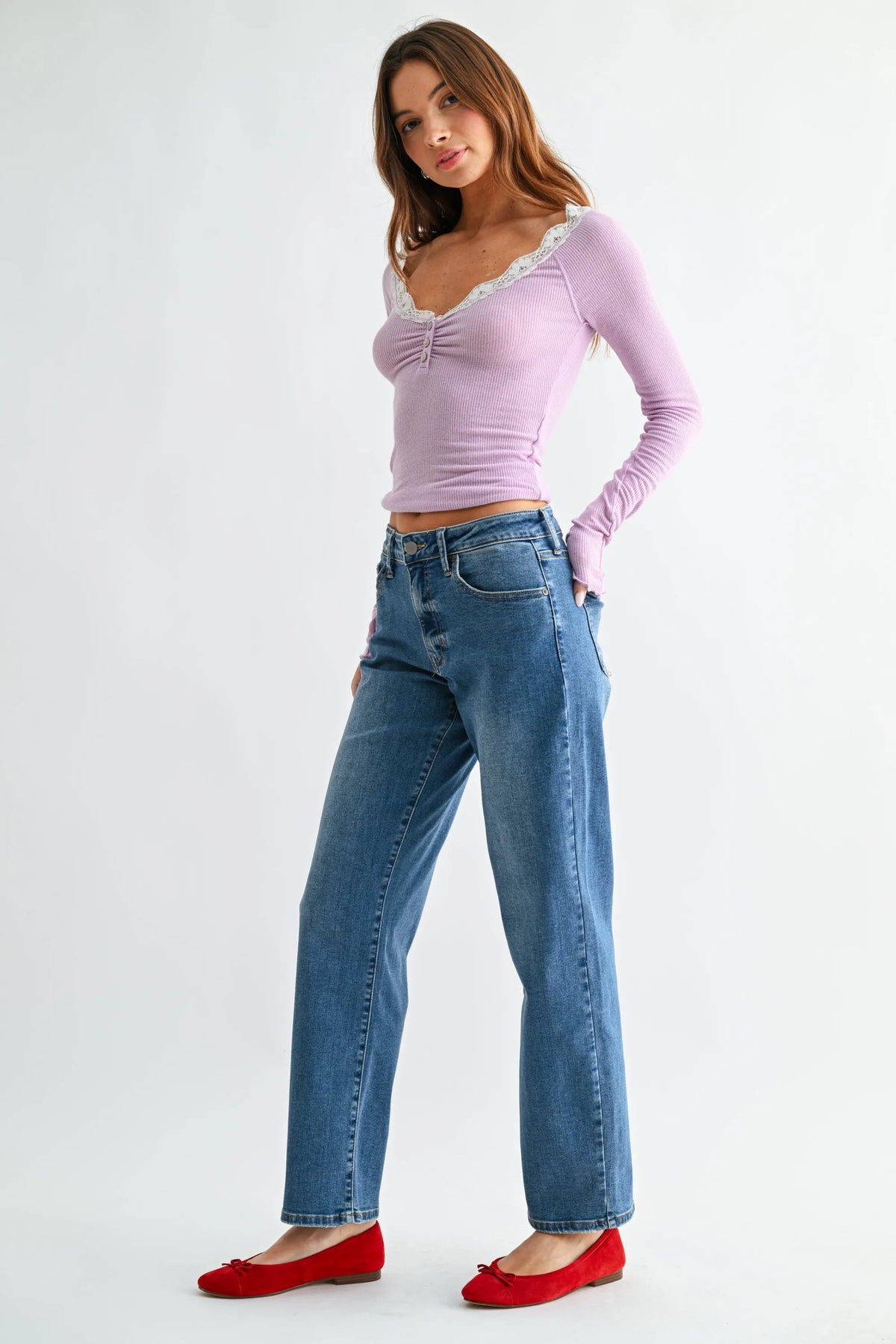 Lavender ribbed long sleeve top with lace trim and gathered front paired with mid rise bowed straight leg jeans denim