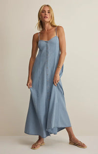 Angel eyes chambray midi dress in light blue denim with thin spaghetti straps and front button closure