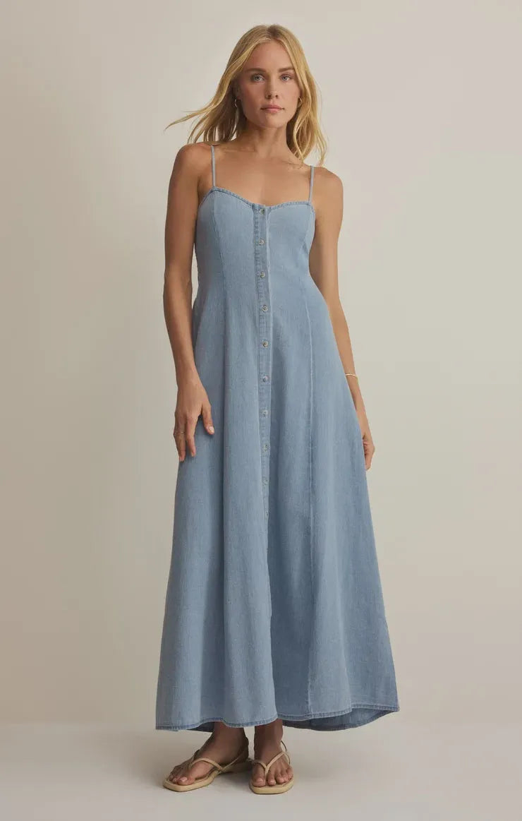 Angel eyes chambray midi dress in light blue denim with thin spaghetti straps and front button closure