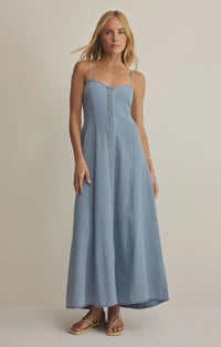 Angel eyes chambray midi dress in light blue denim with thin spaghetti straps and front button closure