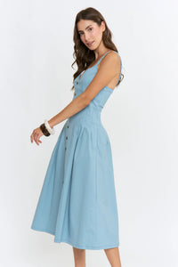 A light blue midi denim dress with thin straps and button-front design perfect for casual wear