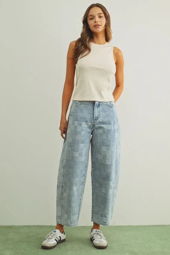 Light blue denim trousers with checker board pattern barrel patchwork design in pattern barrel denim style