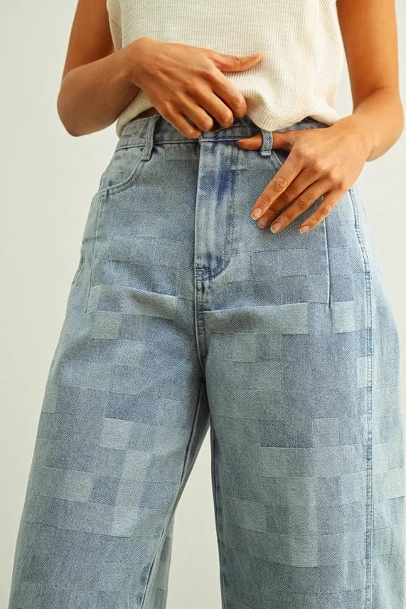 Light blue denim checker board pattern barrel pants with distinctive patchwork texture and varying shades