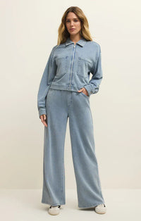 Light blue knit denim jacket with front zipper and two chest pockets in heritage knit denim style