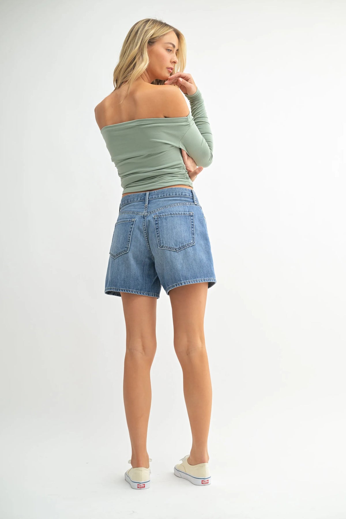 High rise lightweight light blue denim jean shorts with classic five-pocket design and rolled hem for casual wear