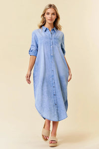 A light blue tencel denim midi shirt dress with rolled up sleeves and button down front for casual wear