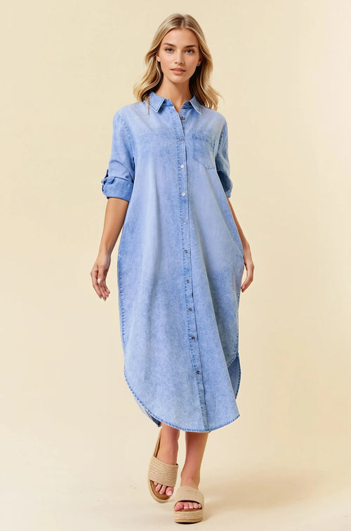 A light blue tencel denim midi shirt dress with rolled up sleeves and button down front for casual wear