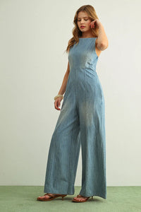 Light blue spaghetti strap chambray jumpsuit with wide-leg design and sleeveless square-neck cut