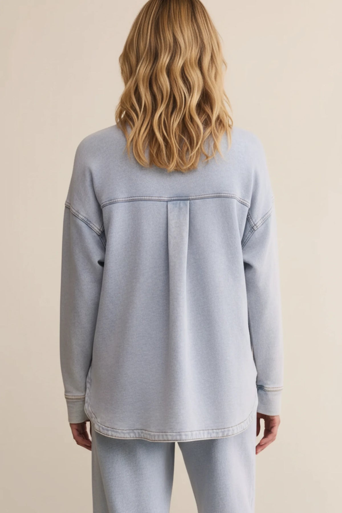 Relaxed fit light wash denim jacket with oversized sweatshirt style