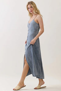 Light blue denim tencel flowy maxi dress with thin straps and front button closure for elegant wear