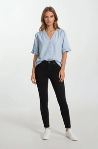 Light blue denim v-neck button down mini ruffle short sleeve top with ruffle short cuffs in soft cotton blend