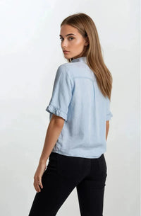 Light blue denim v neck button down mini ruffle short sleeve top with ruffle cuffs for casual wear