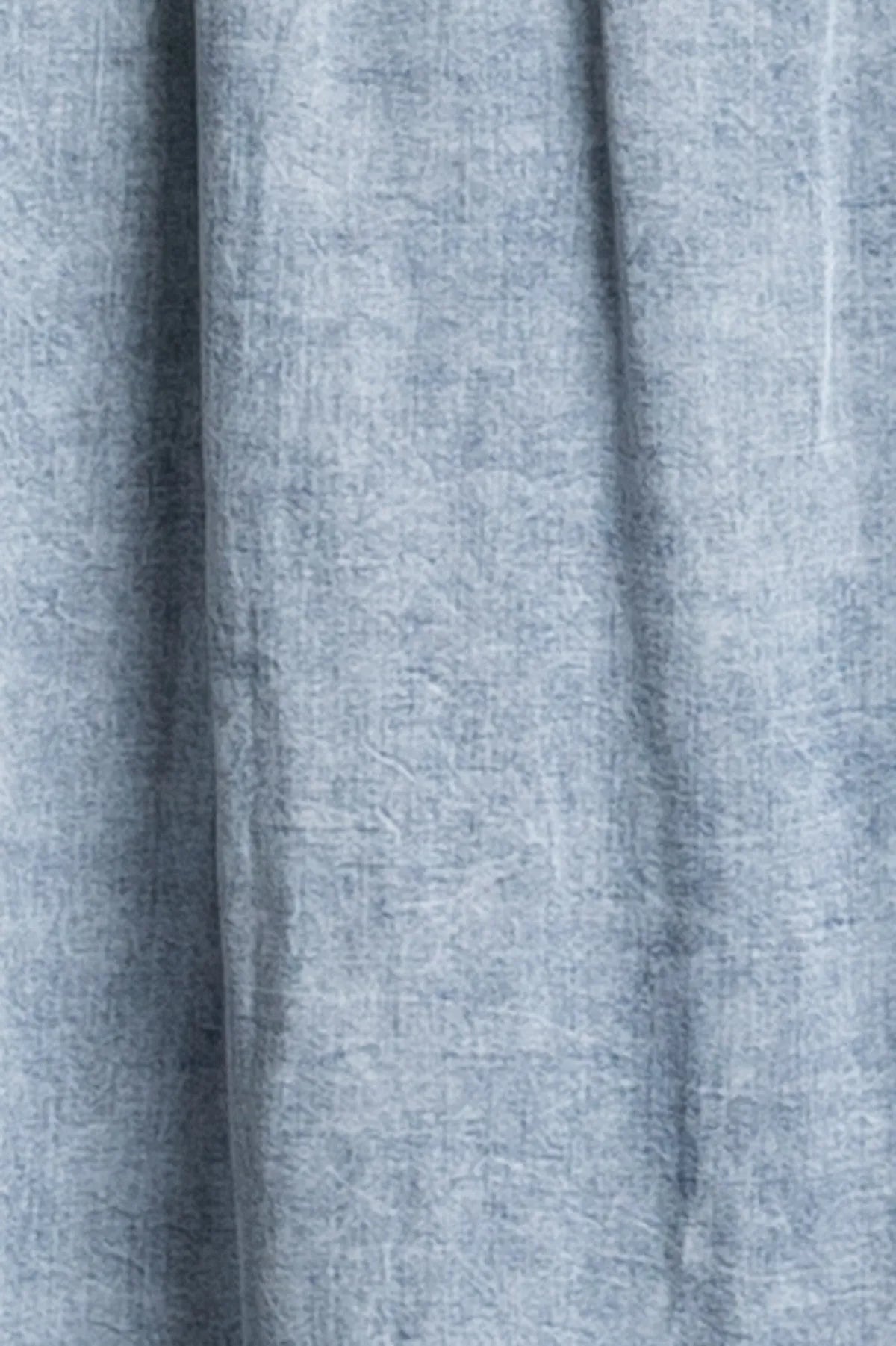 Light blue heathered denim tencel flowy maxi dress fabric with soft textured weave for comfortable wear