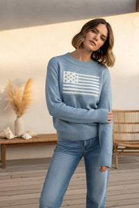 Classic intarsia flag crewneck knit sweater in light blue with white American flag patch