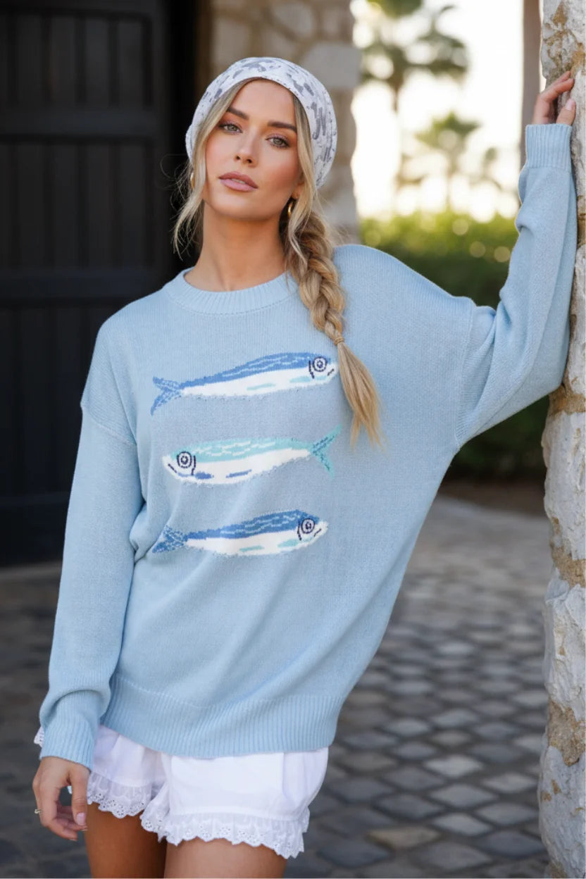 Light blue fish graphic sweater with embroidered blue and white fish