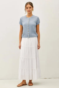 Light blue knitted pointelle stitch short sleeve cardigan with subtle diamond pattern and button closure