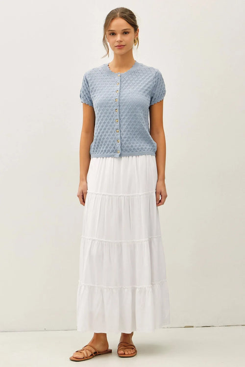 Light blue knitted pointelle stitch short sleeve cardigan with subtle diamond pattern and button closure