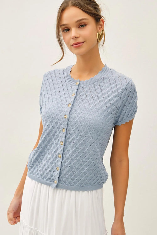 Light blue knitted pointelle stitch short sleeve cardigan with diamond pattern texture and gold toned buttons