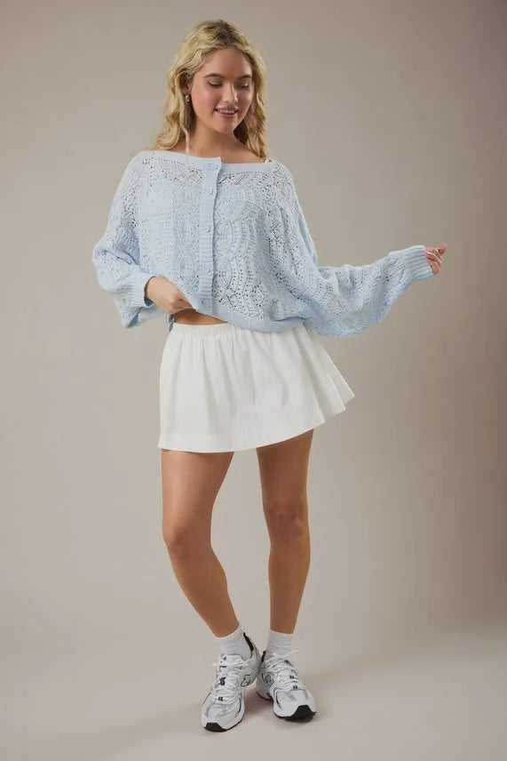 Light blue long sleeve crochet cardigan with intricate lace detailing and bell sleeves open front design