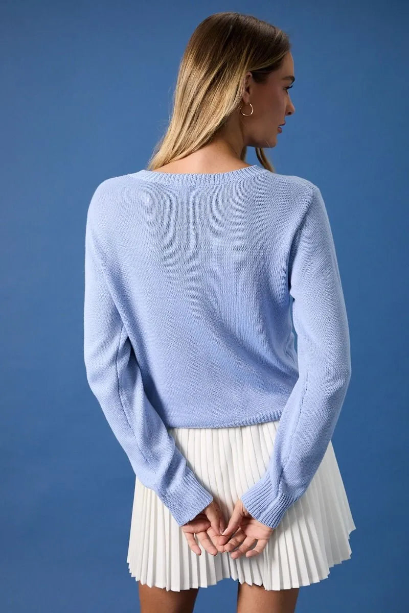 Light blue ribbed knit round neck flag print sweater top with long sleeves and a comfortable fit