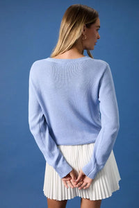 Light blue ribbed knit round neck flag print sweater top with long sleeves and a comfortable fit