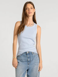 Light blue ribbed sleeveless cotton top featured as thread and supply edlin basic tank for casual wear