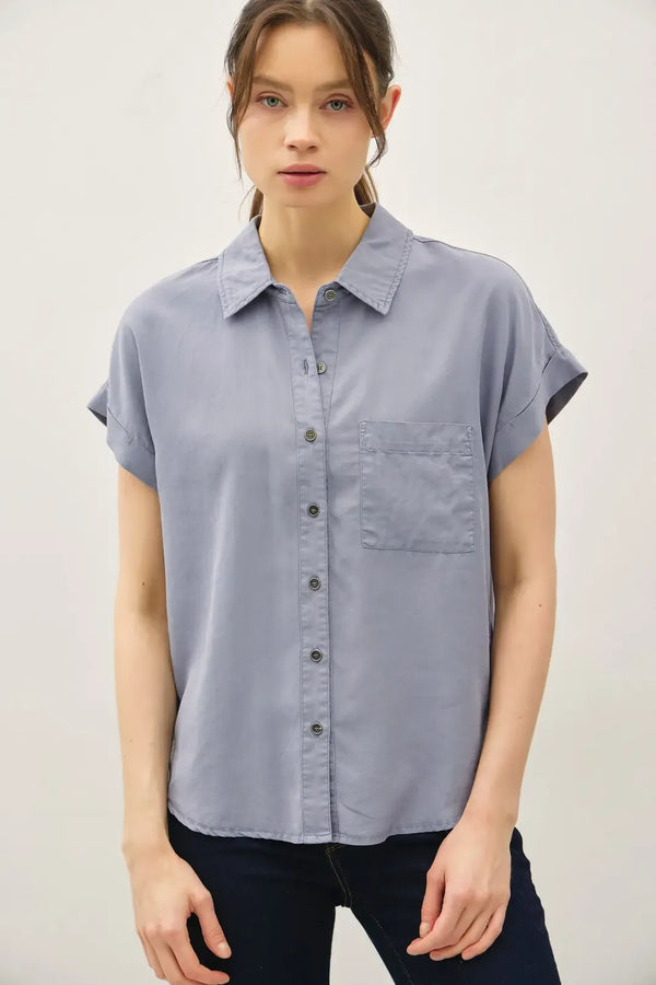 Light blue short dolman sleeve button shirt with collar and chest pocket perfect for casual wear