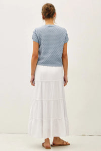 A light blue knitted pointelle stitch short sleeve cardigan with a textured pattern perfect for layering