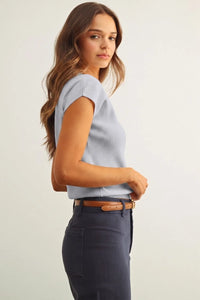 Light blue round neck cap short sleeve knit top with subtle textured fabric and a rounded neckline