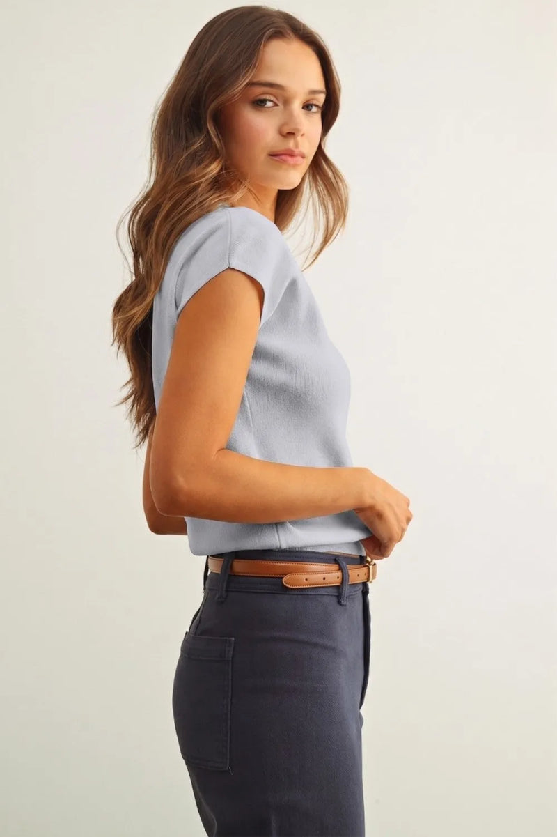 Light blue round neck cap short sleeve knit top with subtle textured fabric and a rounded neckline
