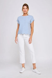 Light blue scallop pattern relaxed knit top with short sleeves and a scalloped hem featuring a wavy texture