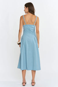A light blue midi denim dress with thin straps and a fitted bodice featuring a button front design
