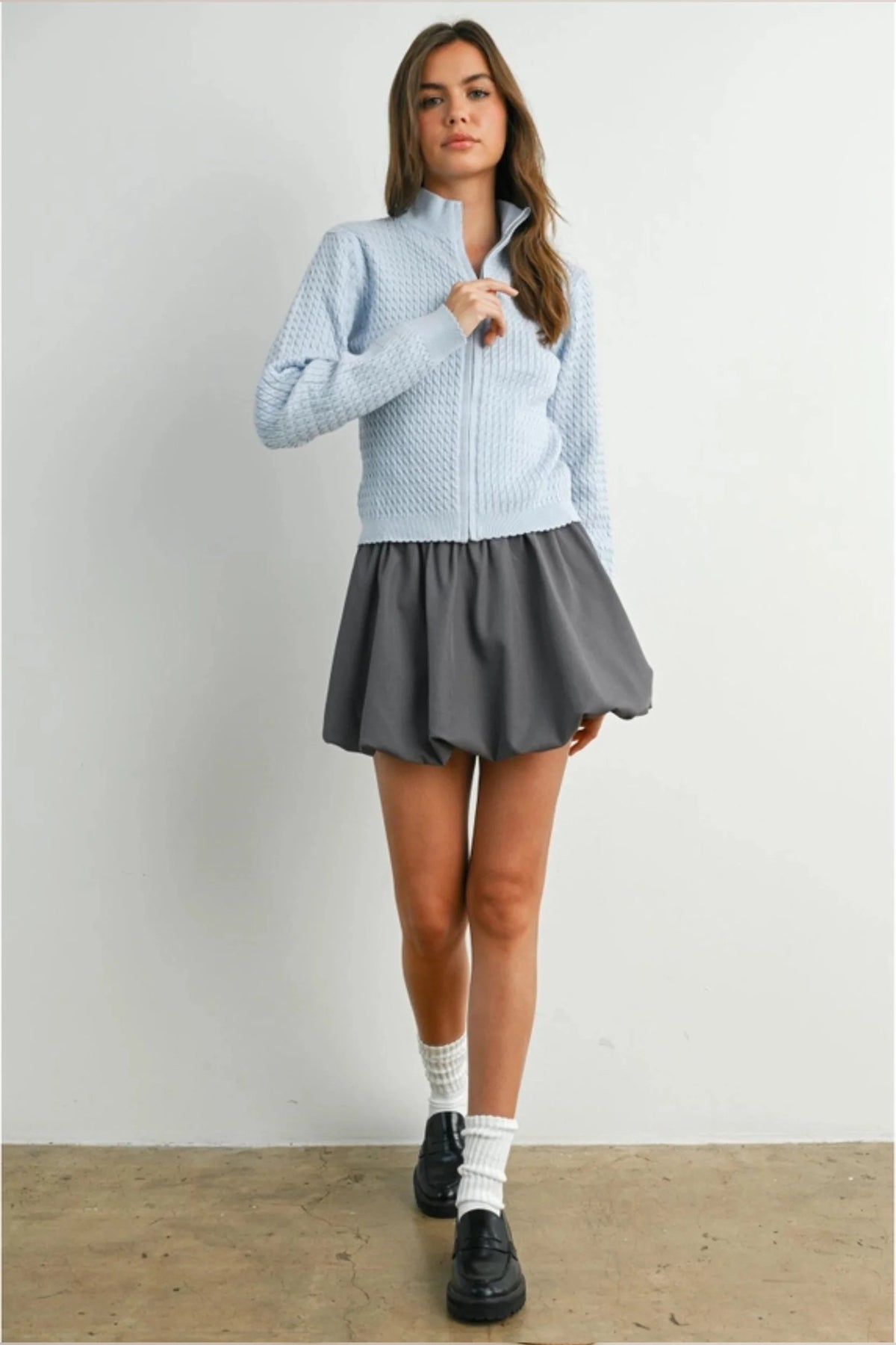 Light blue textured long sleeve mock neck cardigan with high collar