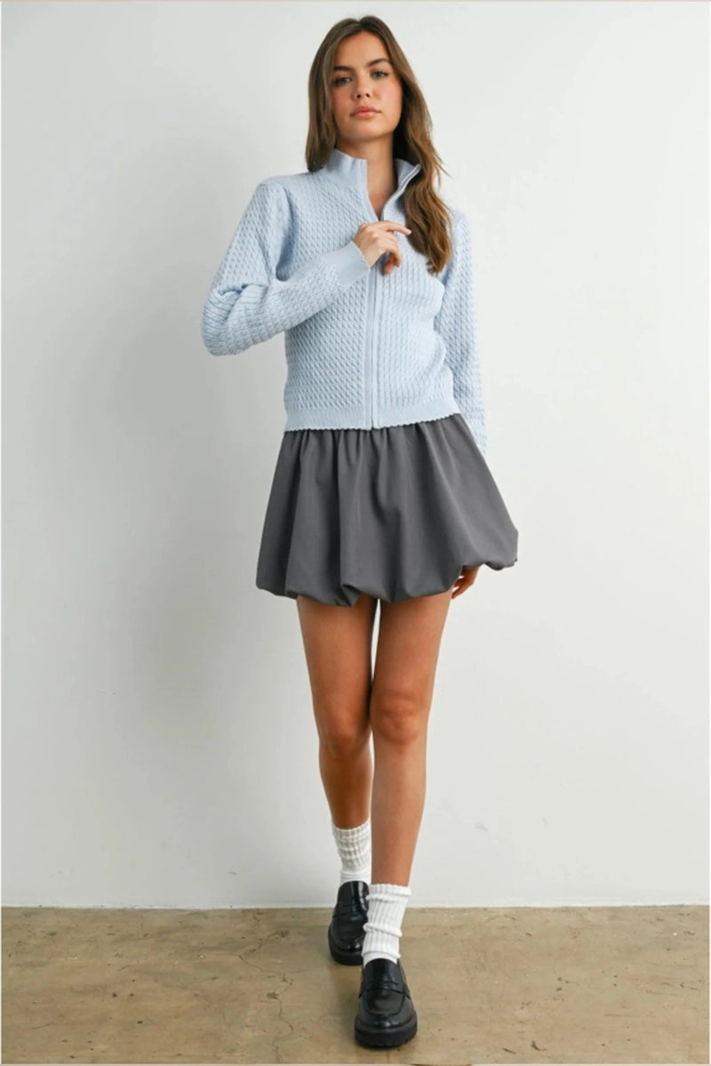 Light blue textured long sleeve mock neck cardigan with high collar