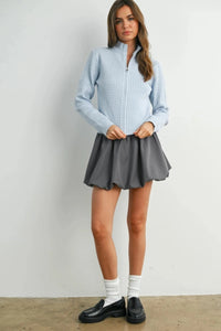 Light blue textured long sleeve mock neck cardigan with high collar