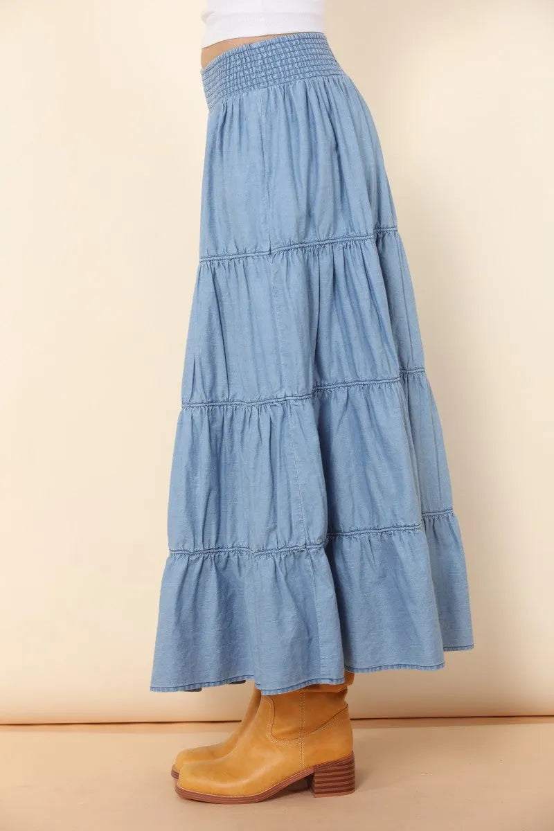 A light blue elastic tiered midi denim skirt with a smocked waistband for stylish casual wear