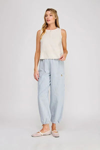Light blue vertically striped cotton trousers with relaxed tapered fit paired with linen button collar textured top